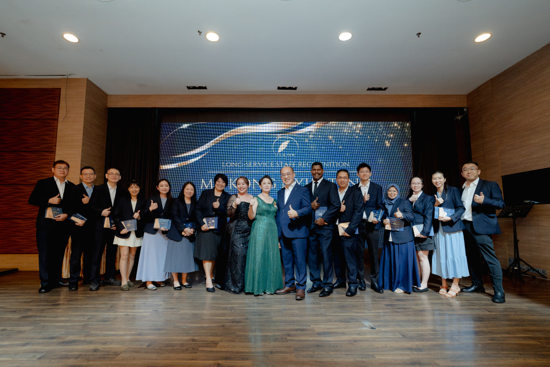 Long Service Staff Recognition — group photo on stage